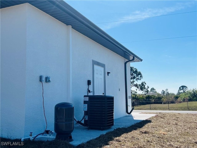 view of side of home with cooling unit