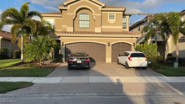 mediterranean / spanish-style house featuring a garage