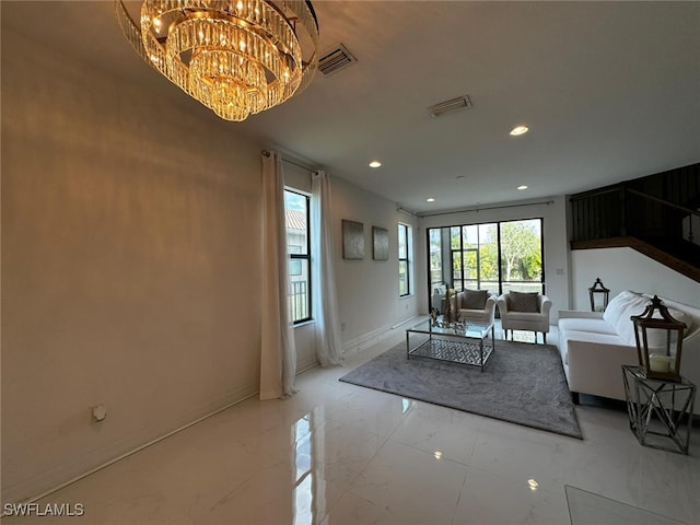 unfurnished living room with a chandelier