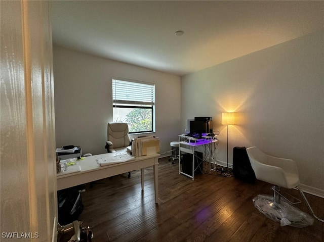 office with dark wood-type flooring