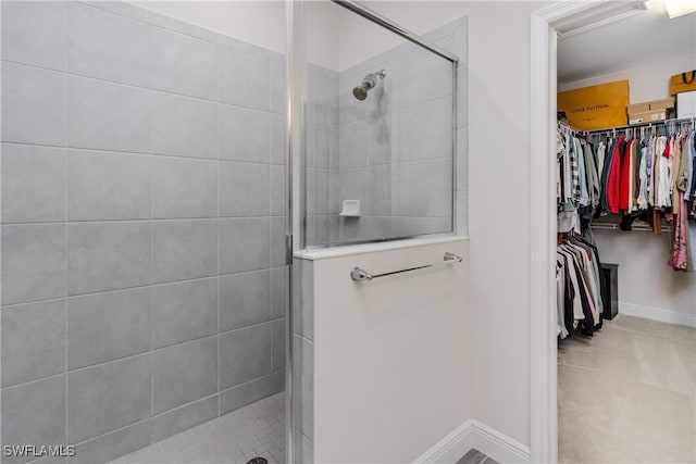 bathroom with a tile shower