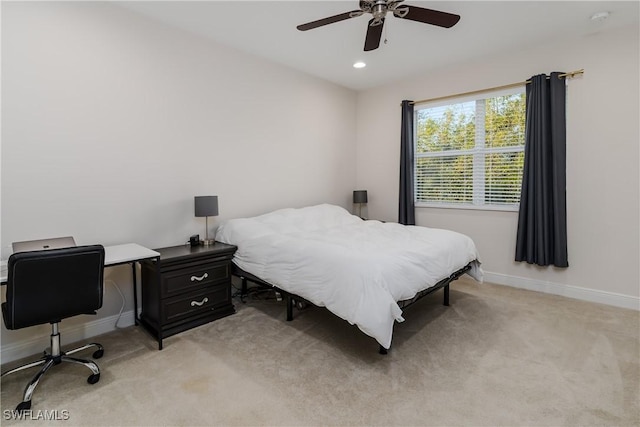 carpeted bedroom featuring ceiling fan