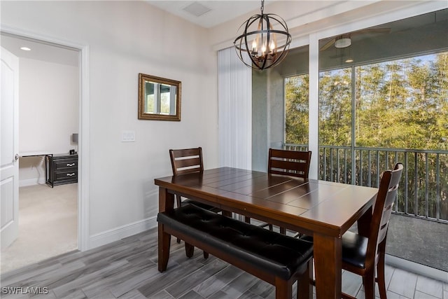 dining area with a notable chandelier