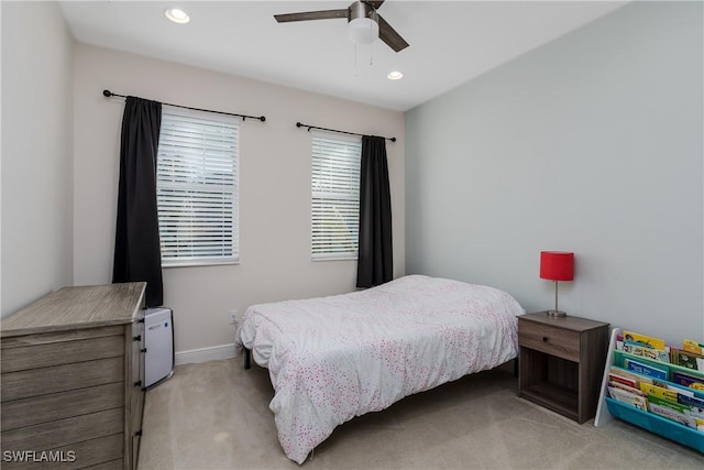 carpeted bedroom with ceiling fan