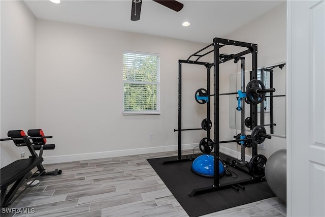 workout room with light hardwood / wood-style floors and ceiling fan