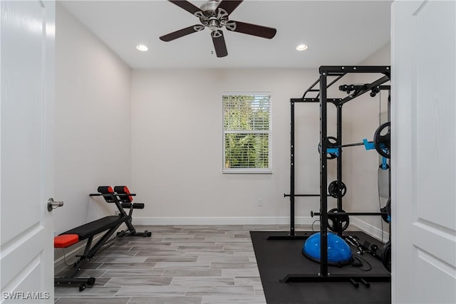 workout area with ceiling fan and light hardwood / wood-style flooring