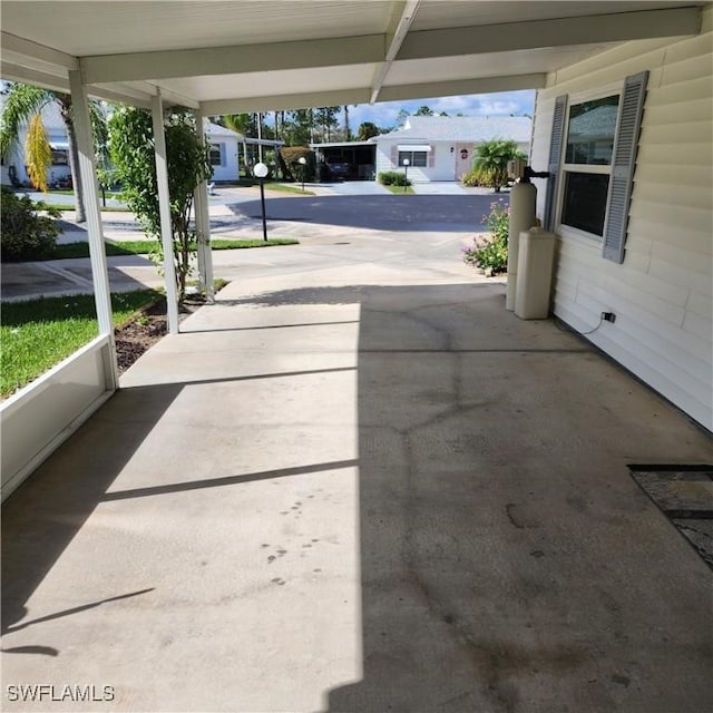 view of patio featuring a carport