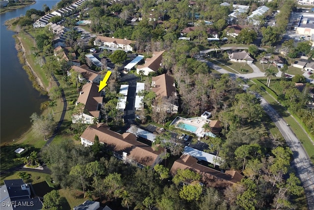 birds eye view of property with a water view