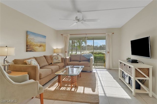 living room featuring ceiling fan and light tile patterned floors