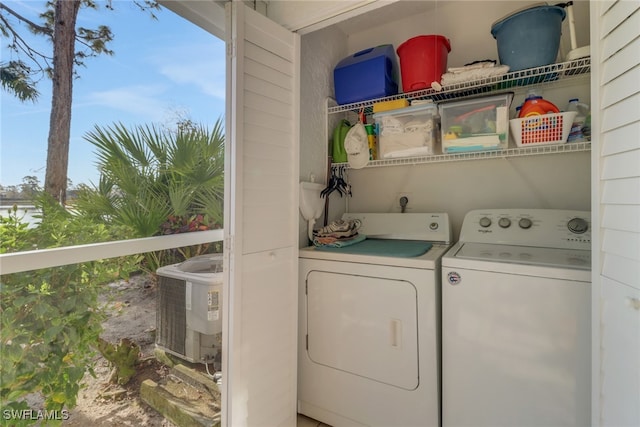 laundry area with washing machine and clothes dryer