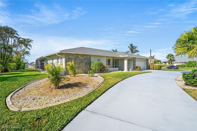 single story home with a garage and a front yard