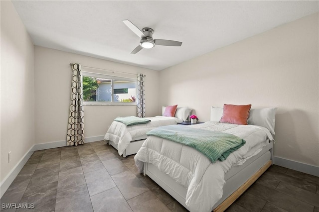 tiled bedroom with ceiling fan