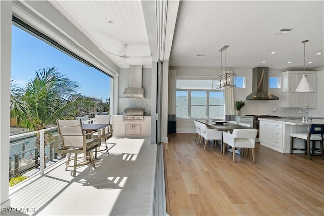 5997 Cypress Ln, Bonita Springs, FL 34134 - dining space featuring an inviting chandelier, recessed lighting, light wood-style flooring, and visible vents