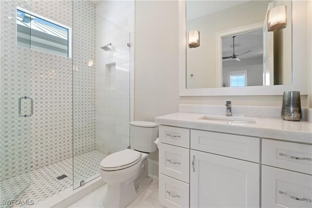 5997 Cypress Ln, Bonita Springs, FL 34134 - bathroom featuring toilet, a shower stall, a wealth of natural light, and vanity