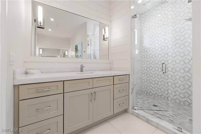 bathroom with vanity, tile patterned floors, and walk in shower