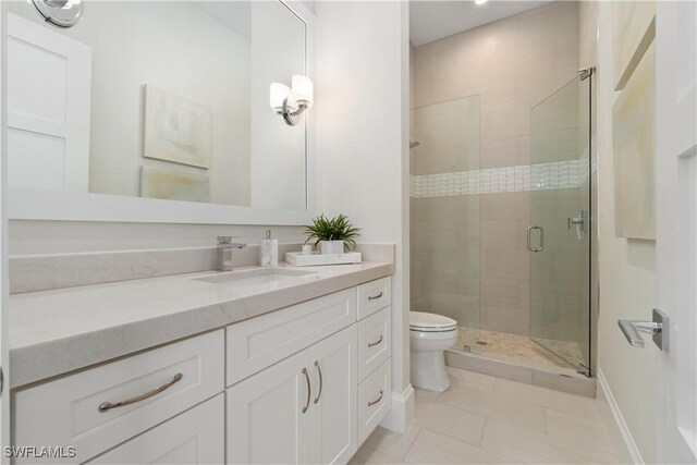 5997 Cypress Ln, Bonita Springs, FL 34134 - full bath featuring vanity, toilet, tile patterned floors, baseboards, and a shower stall