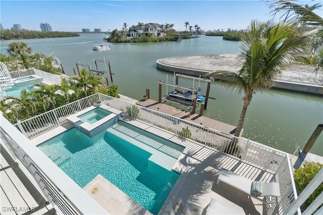 5997 Cypress Ln, Bonita Springs, FL 34134 - view of swimming pool with boat lift, a pool with connected hot tub, a water view, and a boat dock