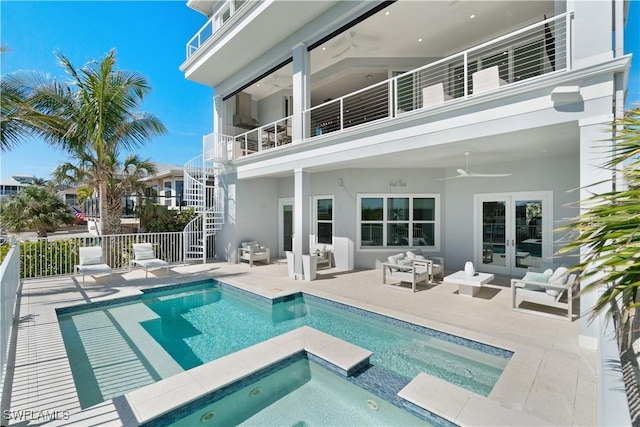 5997 Cypress Ln, Bonita Springs, FL 34134 - rear view of house featuring fence, a balcony, a ceiling fan, an in ground hot tub, and stairway