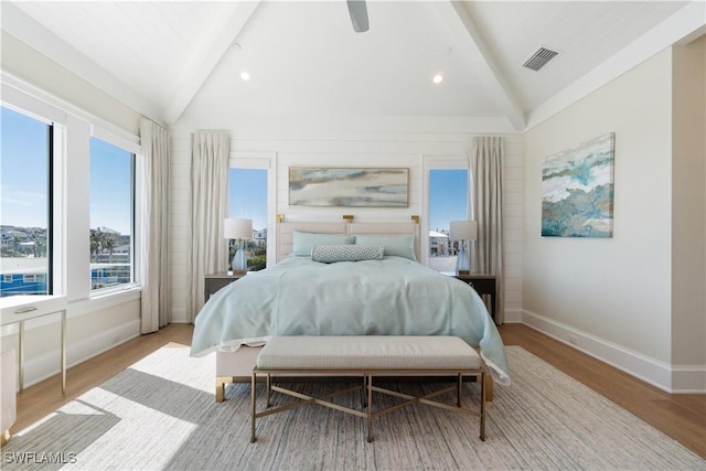 5997 Cypress Ln, Bonita Springs, FL 34134 - bedroom with ceiling fan, lofted ceiling with beams, baseboards, wood finished floors, and visible vents