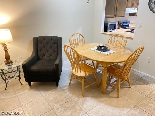 dining room featuring light tile patterned floors