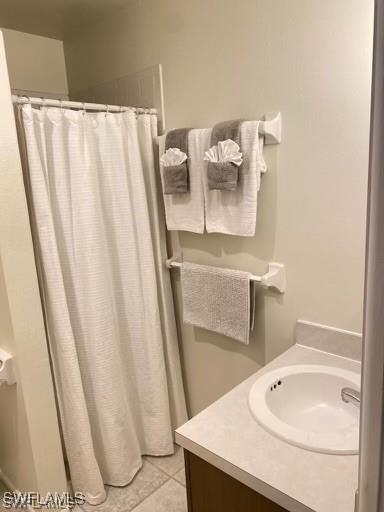 bathroom with tile patterned floors and vanity