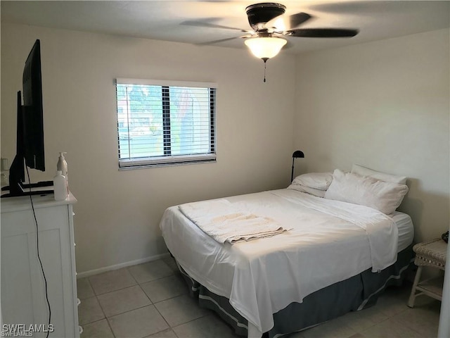 bedroom with light tile patterned floors and ceiling fan