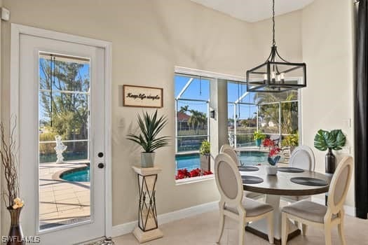 dining area with a notable chandelier and a healthy amount of sunlight