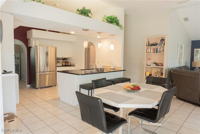 tiled dining area featuring sink