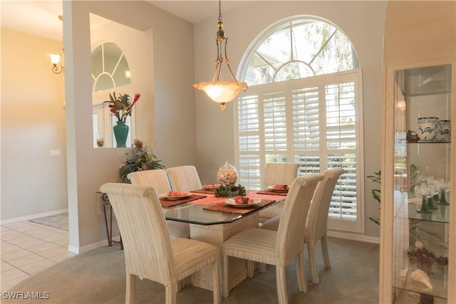 dining area with light tile patterned floors