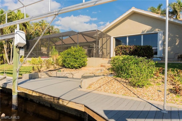 rear view of property with a lanai