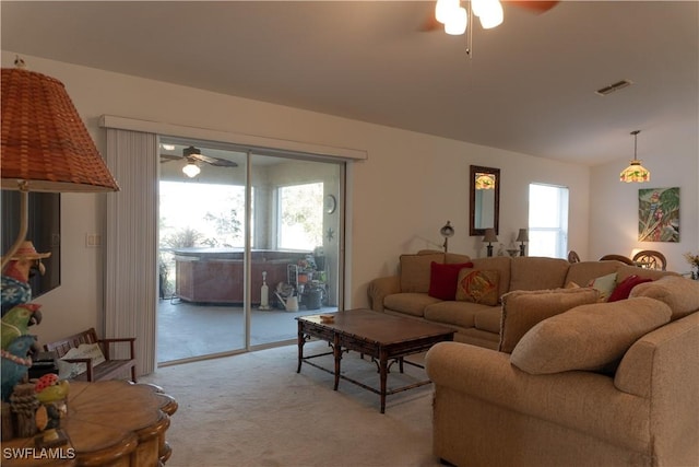 living room featuring lofted ceiling, light carpet, and ceiling fan