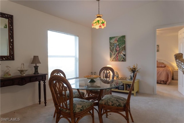 dining room with light colored carpet