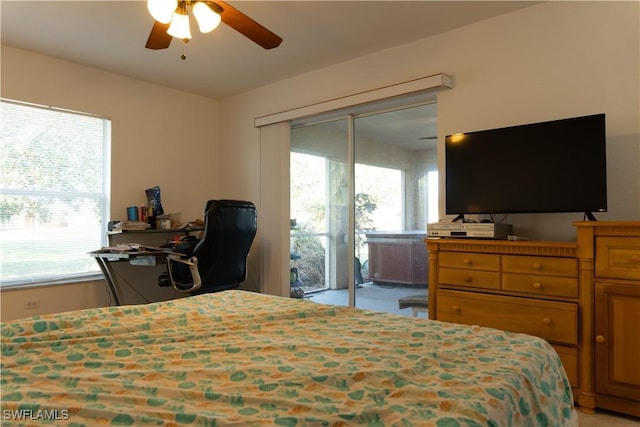 bedroom featuring multiple windows, access to outside, and ceiling fan