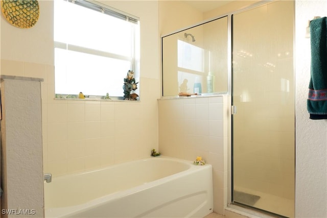 bathroom featuring plus walk in shower