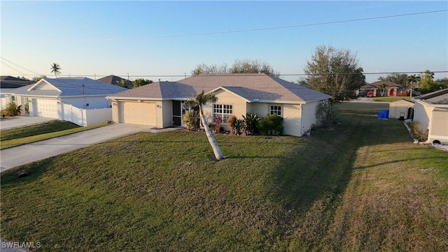 ranch-style house featuring a garage and a front yard