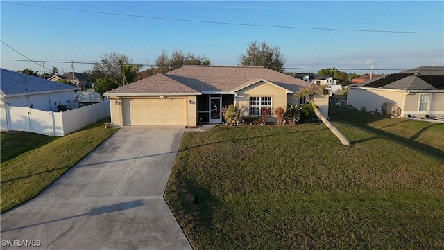 ranch-style house with a garage and a front yard