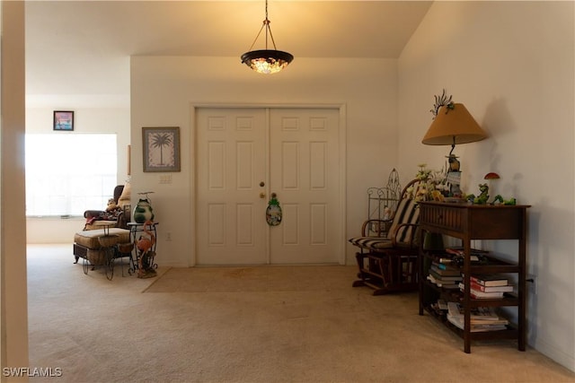 view of carpeted entrance foyer