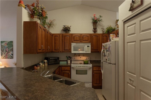 kitchen featuring sink, white appliances, high vaulted ceiling, and kitchen peninsula