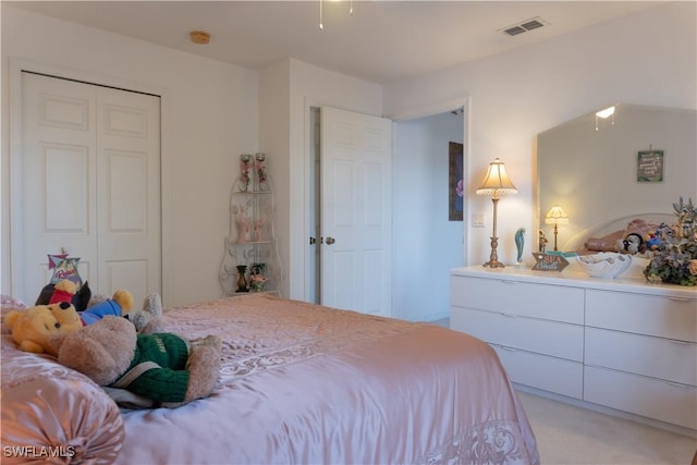 carpeted bedroom featuring a closet