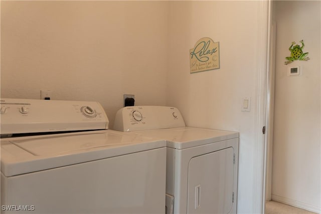 laundry room with washing machine and dryer