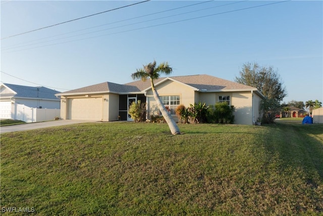 ranch-style house featuring a garage and a front lawn