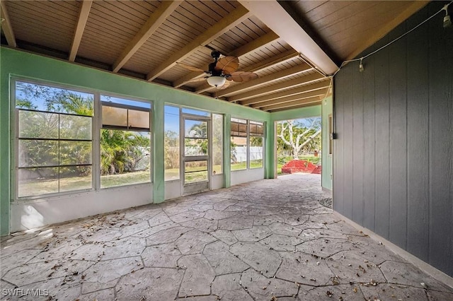 unfurnished sunroom with wooden ceiling, ceiling fan, and beamed ceiling