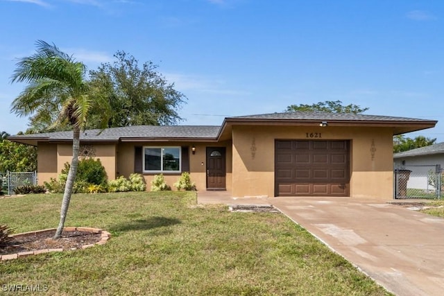 ranch-style house featuring driveway, stucco siding, an attached garage, fence, and a front yard