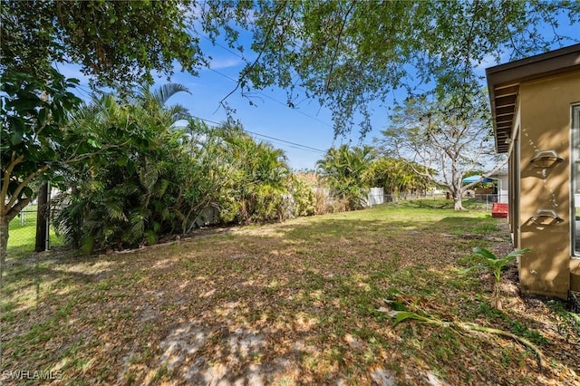 view of yard with a fenced backyard