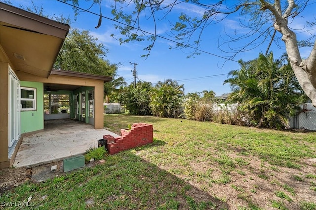 view of yard with a patio and fence