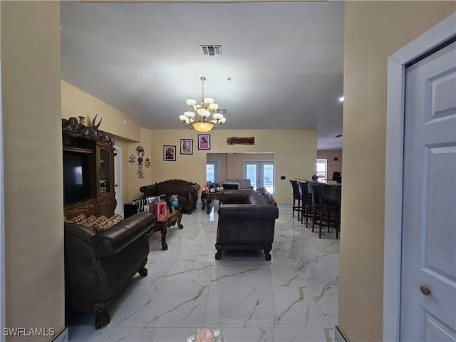 living room featuring a notable chandelier