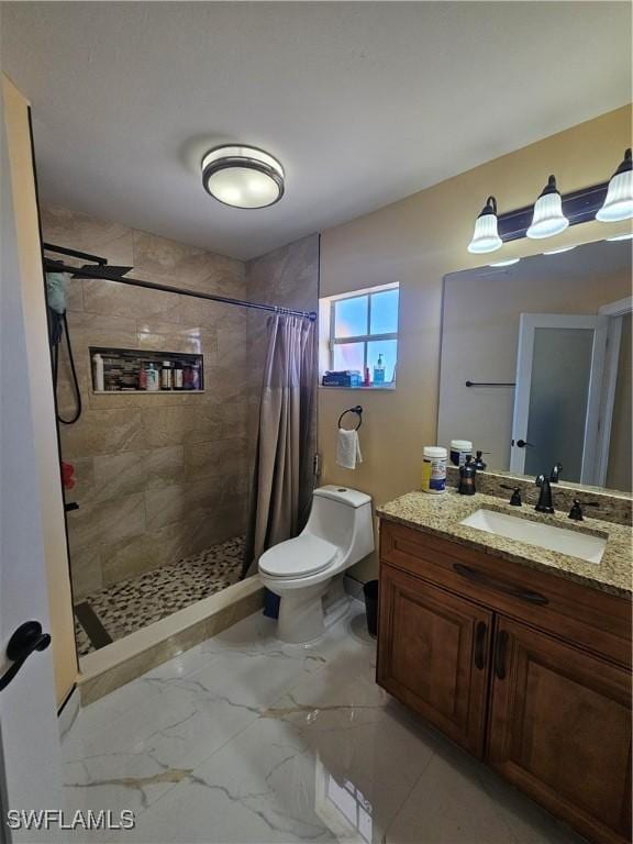 bathroom featuring vanity, toilet, and walk in shower