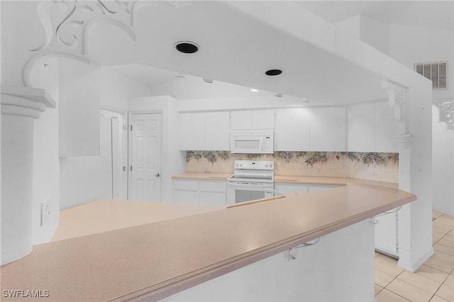 kitchen with tasteful backsplash, white cabinetry, light tile patterned floors, and white appliances