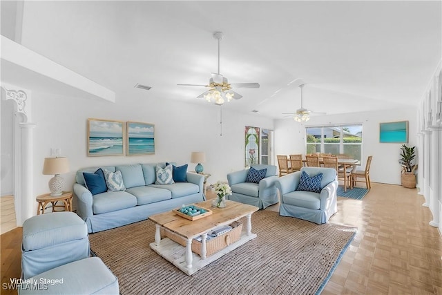 living room with vaulted ceiling and visible vents