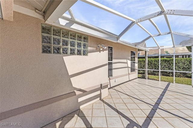 unfurnished sunroom with lofted ceiling